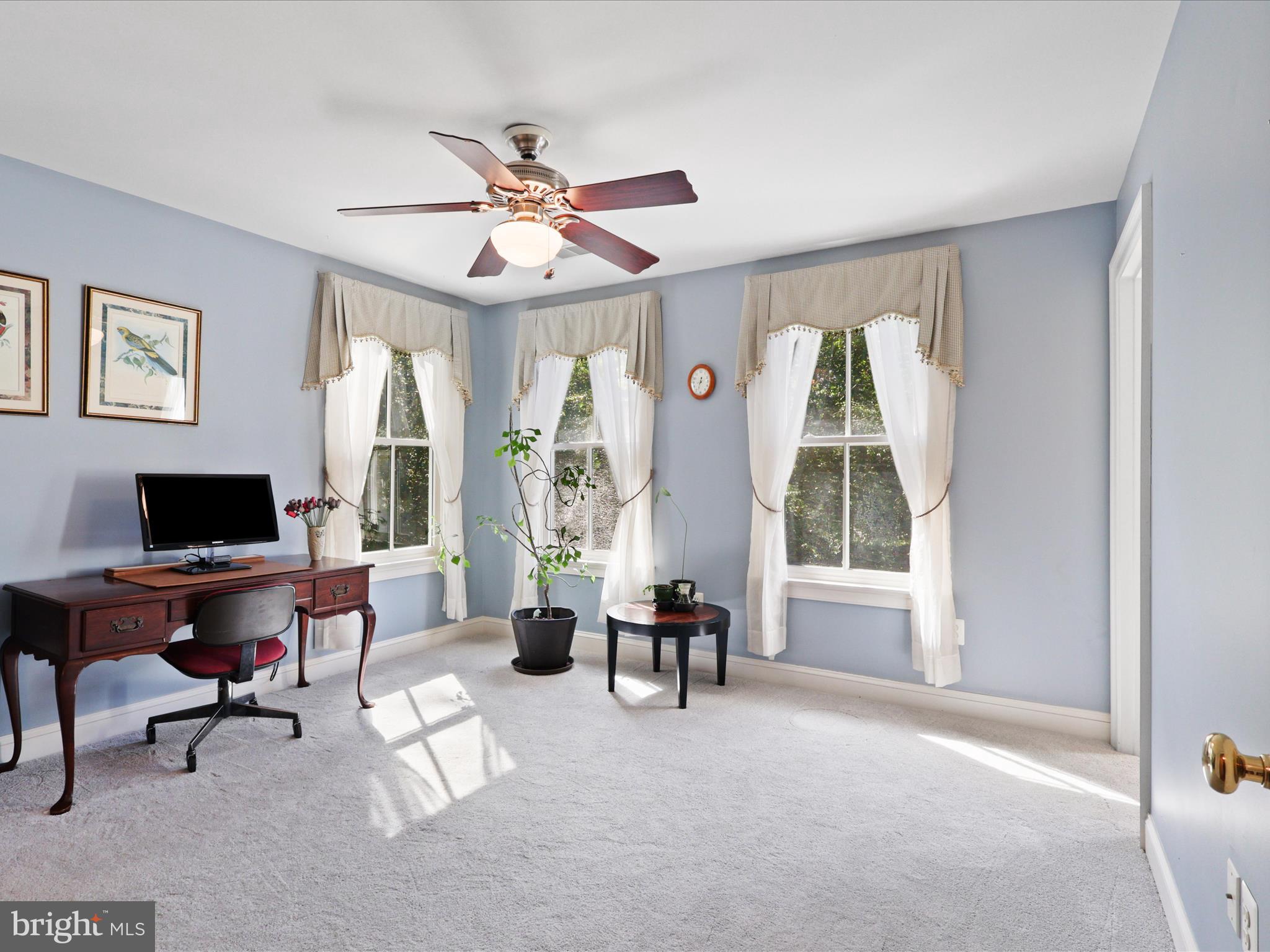 12848 Redbird Ridge Clifton, VA 20124 - Photo 38 of 76 a living room with furniture and a window