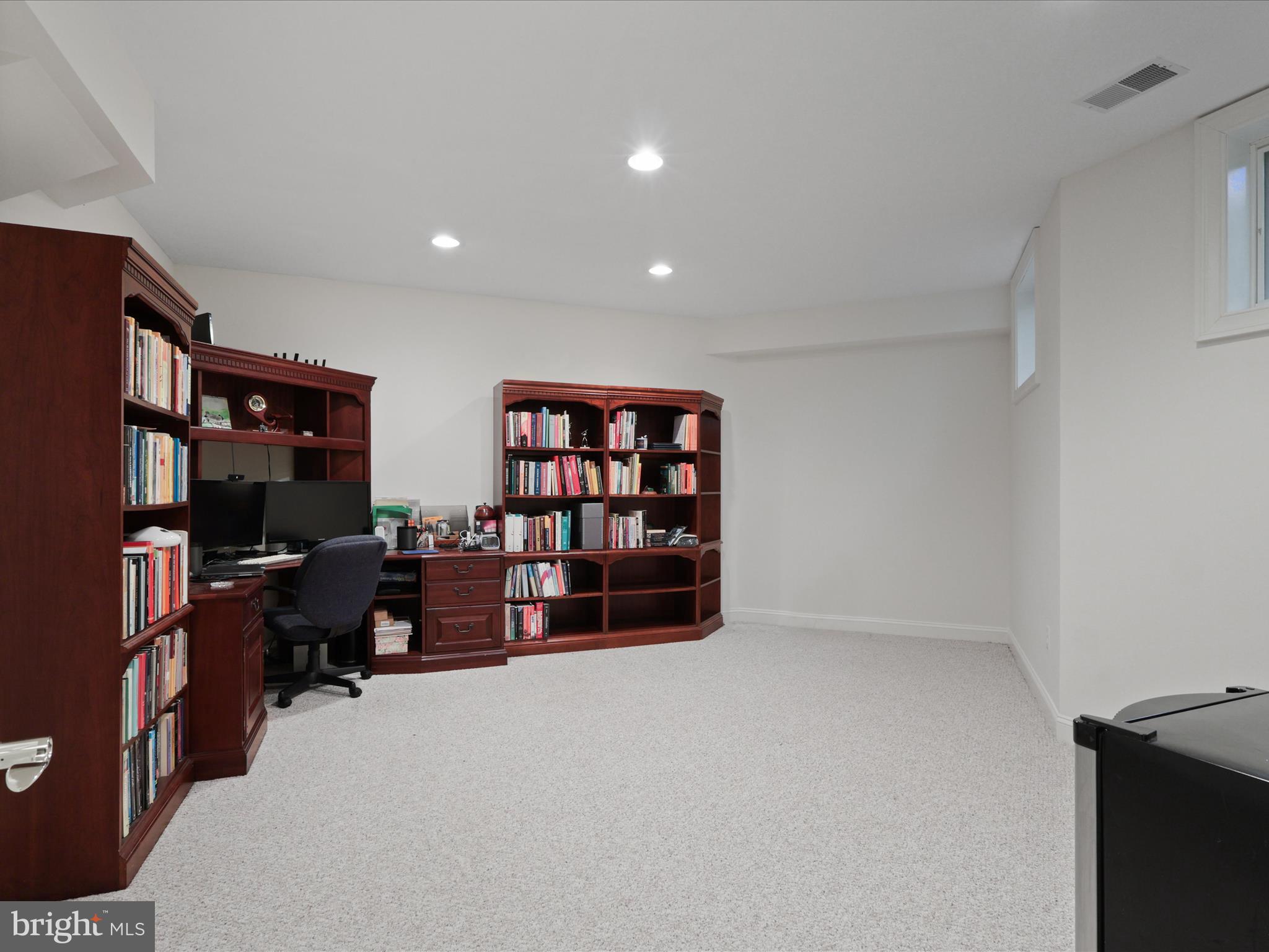 12848 Redbird Ridge Clifton, VA 20124 - Photo 45 of 76 a view of livingroom with workspace and a couch