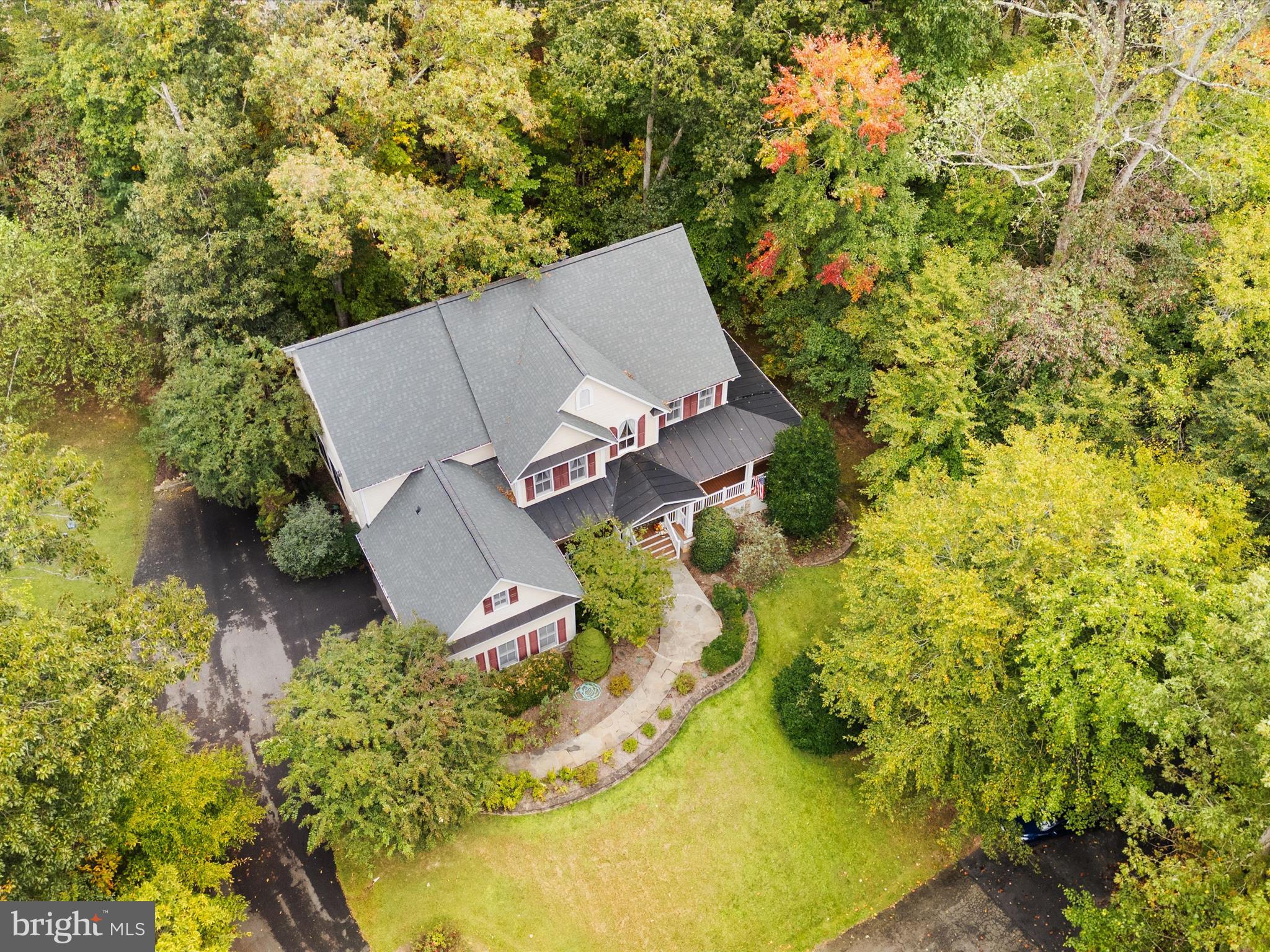 12848 Redbird Ridge Clifton, VA 20124 - Photo 5 of 76 an aerial view of a house with swimming pool and garden