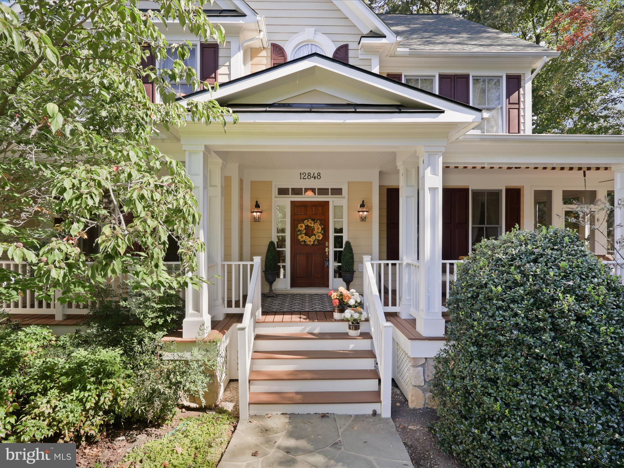 12848 Redbird Ridge Clifton, VA 20124 - Photo 6 of 76 a view of a house with entrance gate