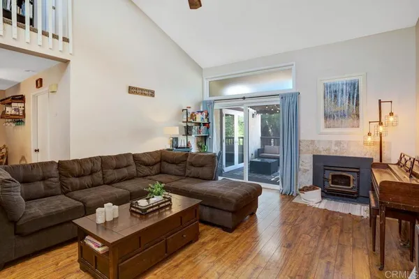 a living room with furniture fireplace and a flat screen tv