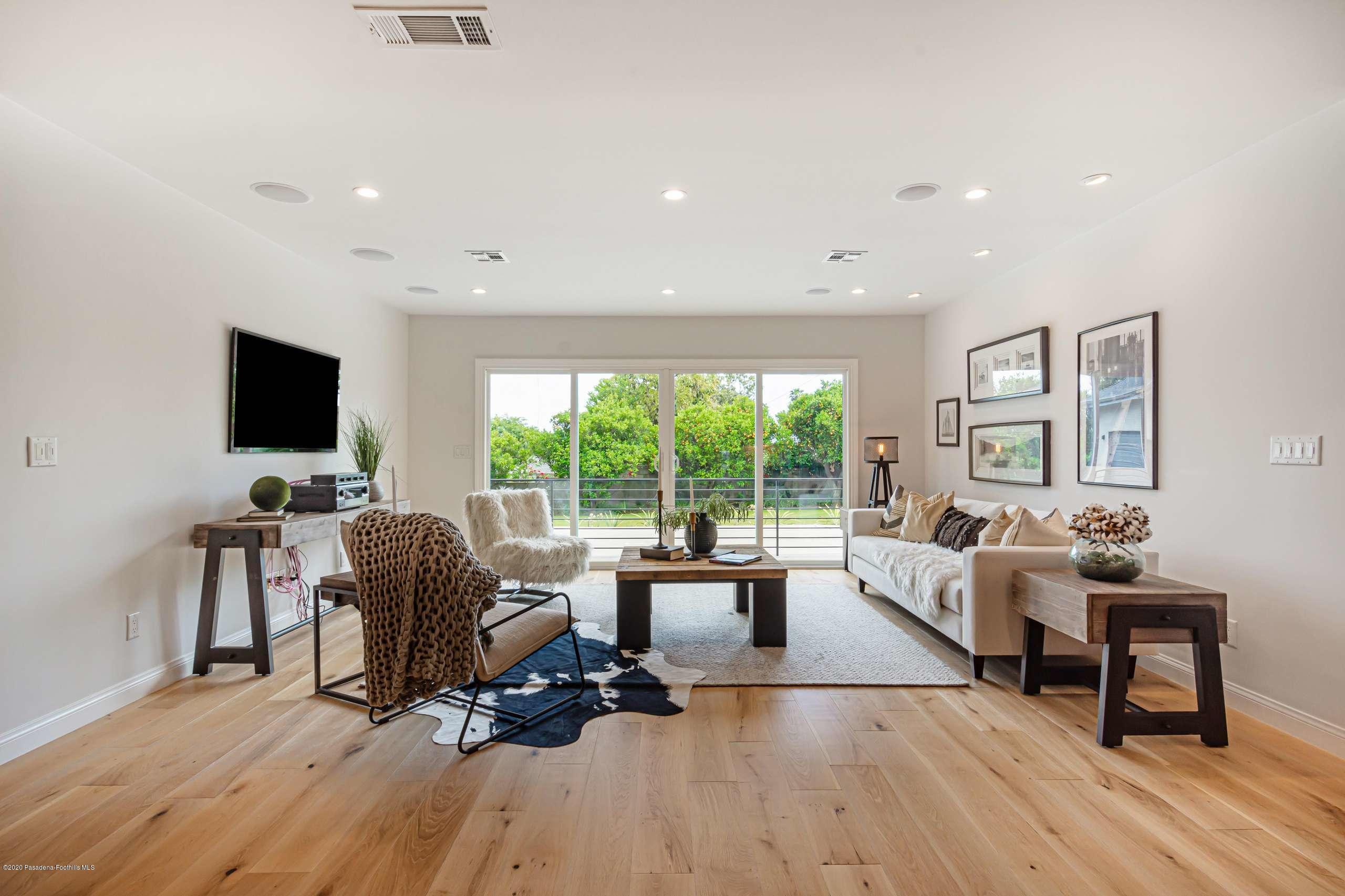 3590 Fairmeade Road Pasadena, CA 91107 - Photo 17 of 45 a living room with furniture and a flat screen tv