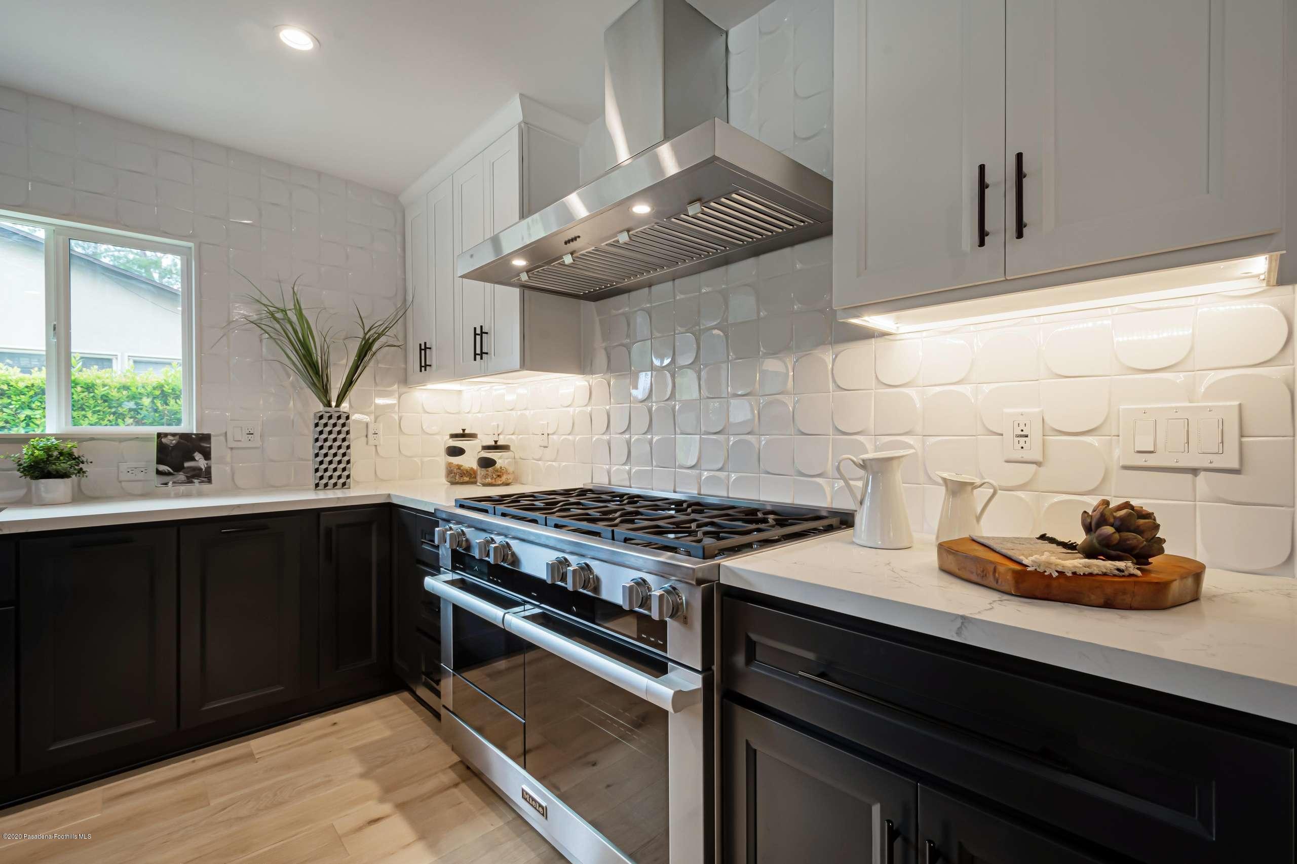 3590 Fairmeade Road Pasadena, CA 91107 - Photo 21 of 45 a kitchen with granite countertop a stove and a sink