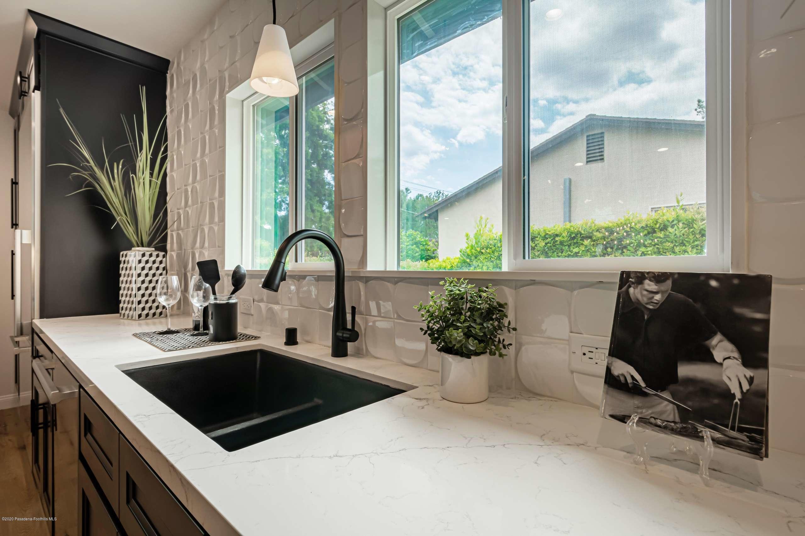 3590 Fairmeade Road Pasadena, CA 91107 - Photo 22 of 45 a kitchen with a sink and a large window