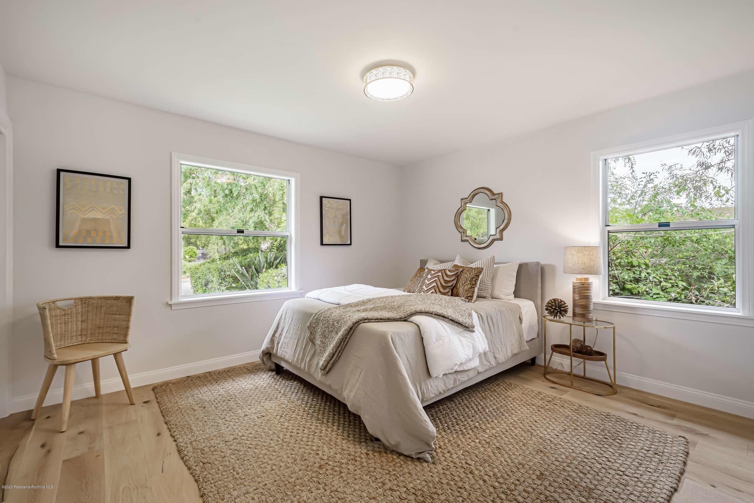 3590 Fairmeade Road Pasadena, CA 91107 - Photo 27 of 45 a bed room with a bed and a chair