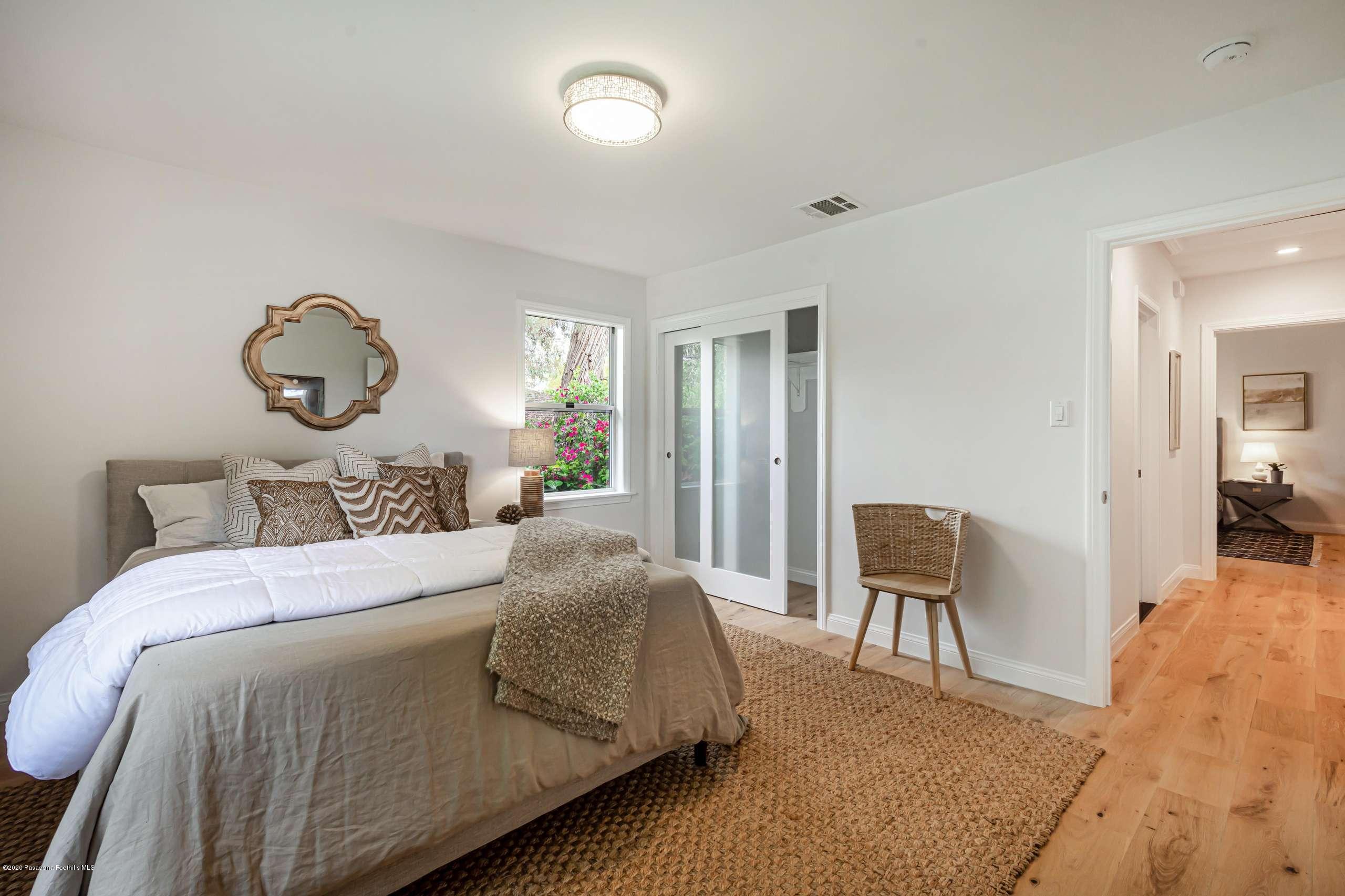 3590 Fairmeade Road Pasadena, CA 91107 - Photo 28 of 45 a living room with a bed furniture and a large window