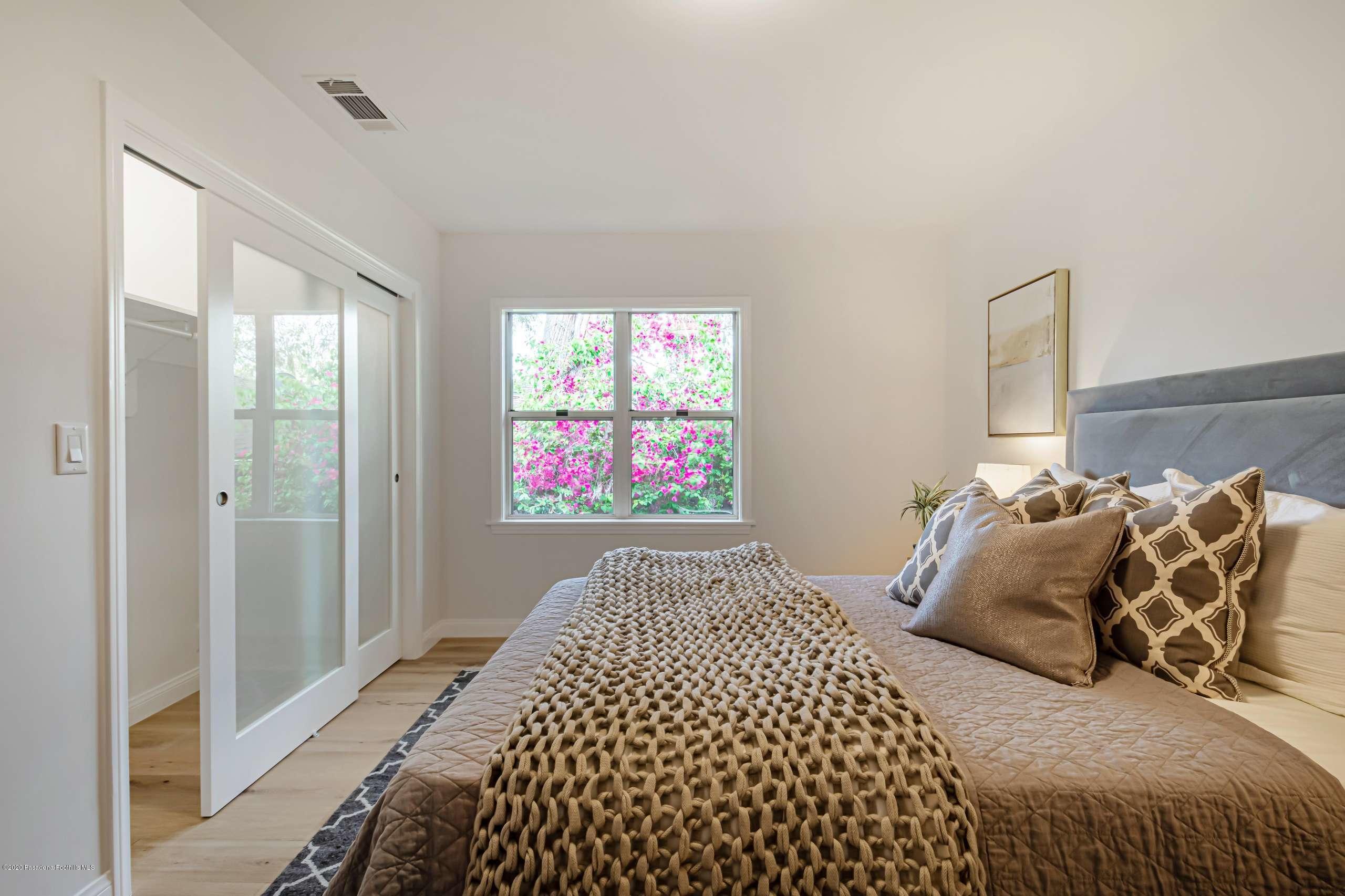 3590 Fairmeade Road Pasadena, CA 91107 - Photo 29 of 45 a bedroom with a bed and a window