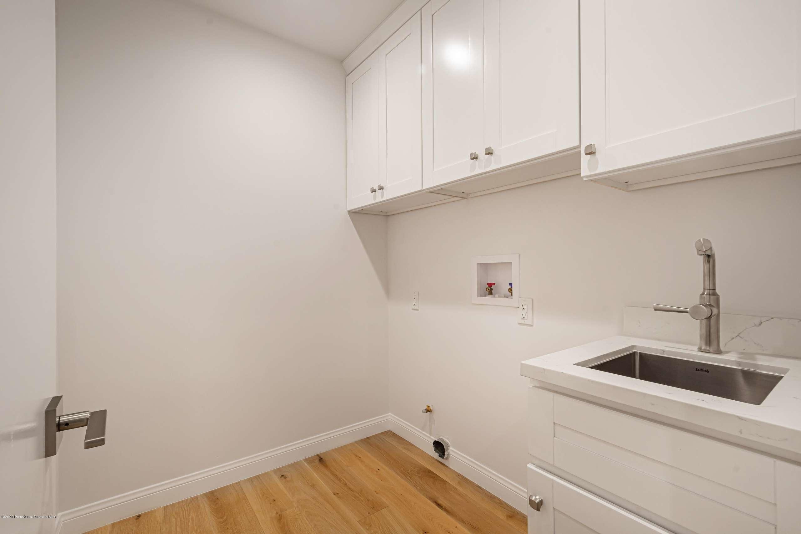 3590 Fairmeade Road Pasadena, CA 91107 - Photo 41 of 45 a bathroom with a sink and cabinets