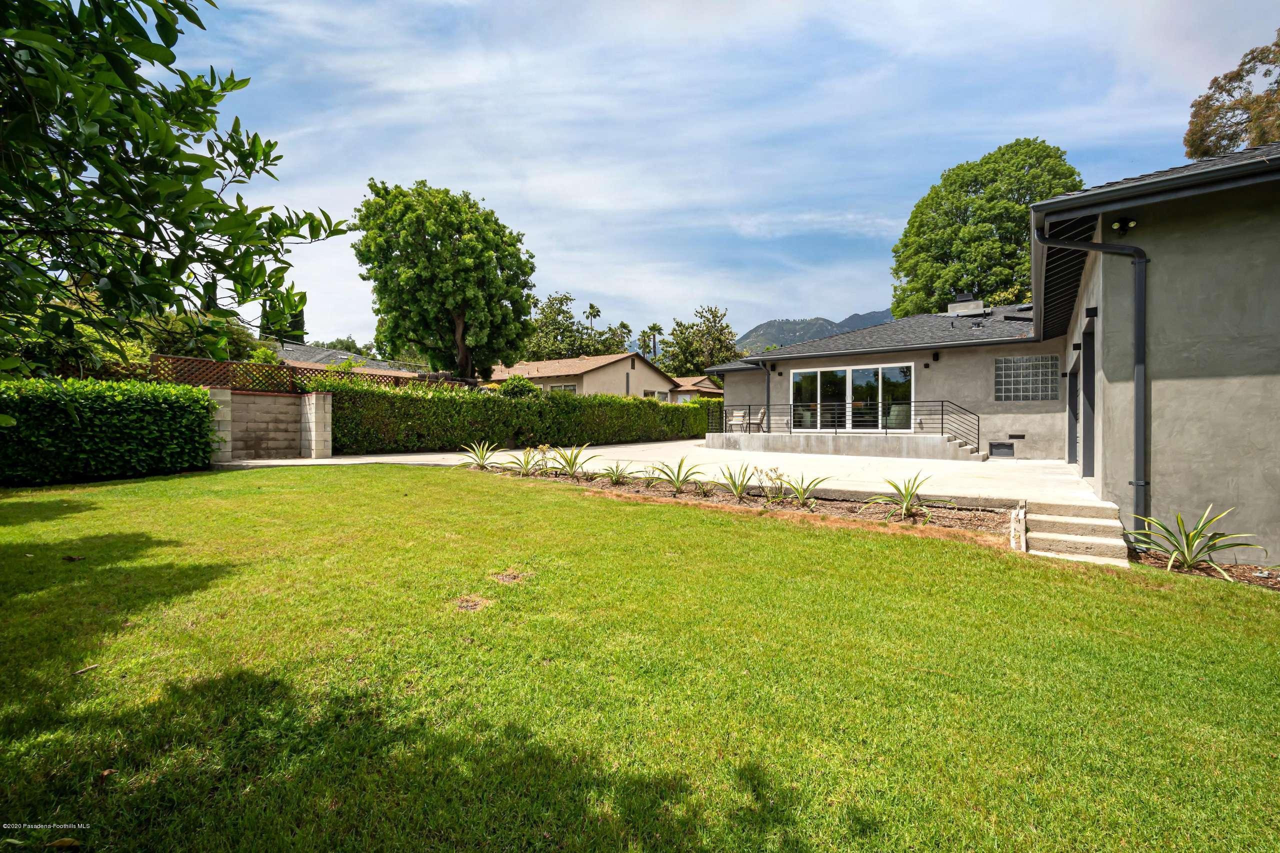 3590 Fairmeade Road Pasadena, CA 91107 - Photo 45 of 45 a front view of a house with swimming pool having outdoor seating