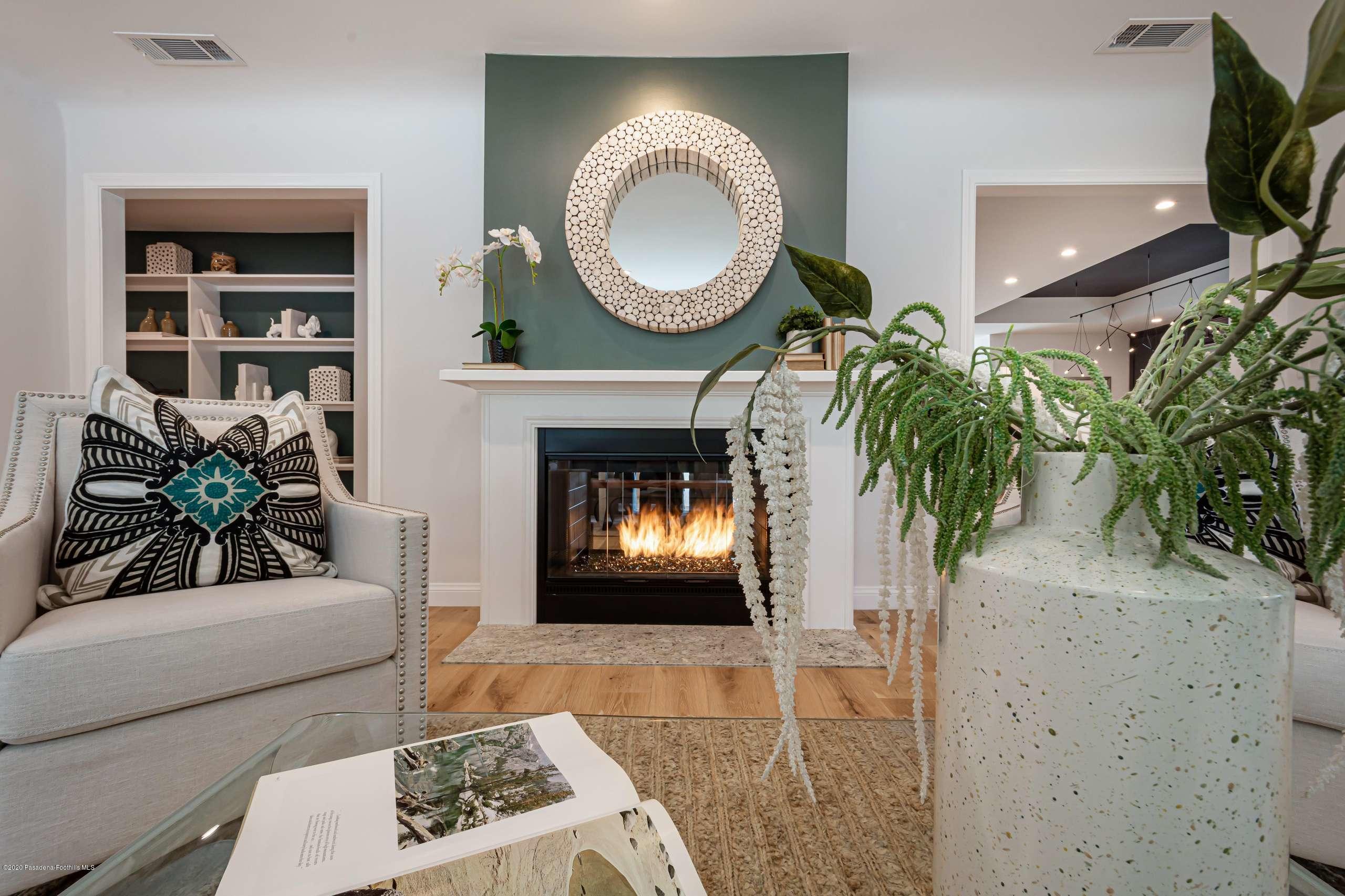 3590 Fairmeade Road Pasadena, CA 91107 - Photo 10 of 45 a living room with furniture and a fireplace