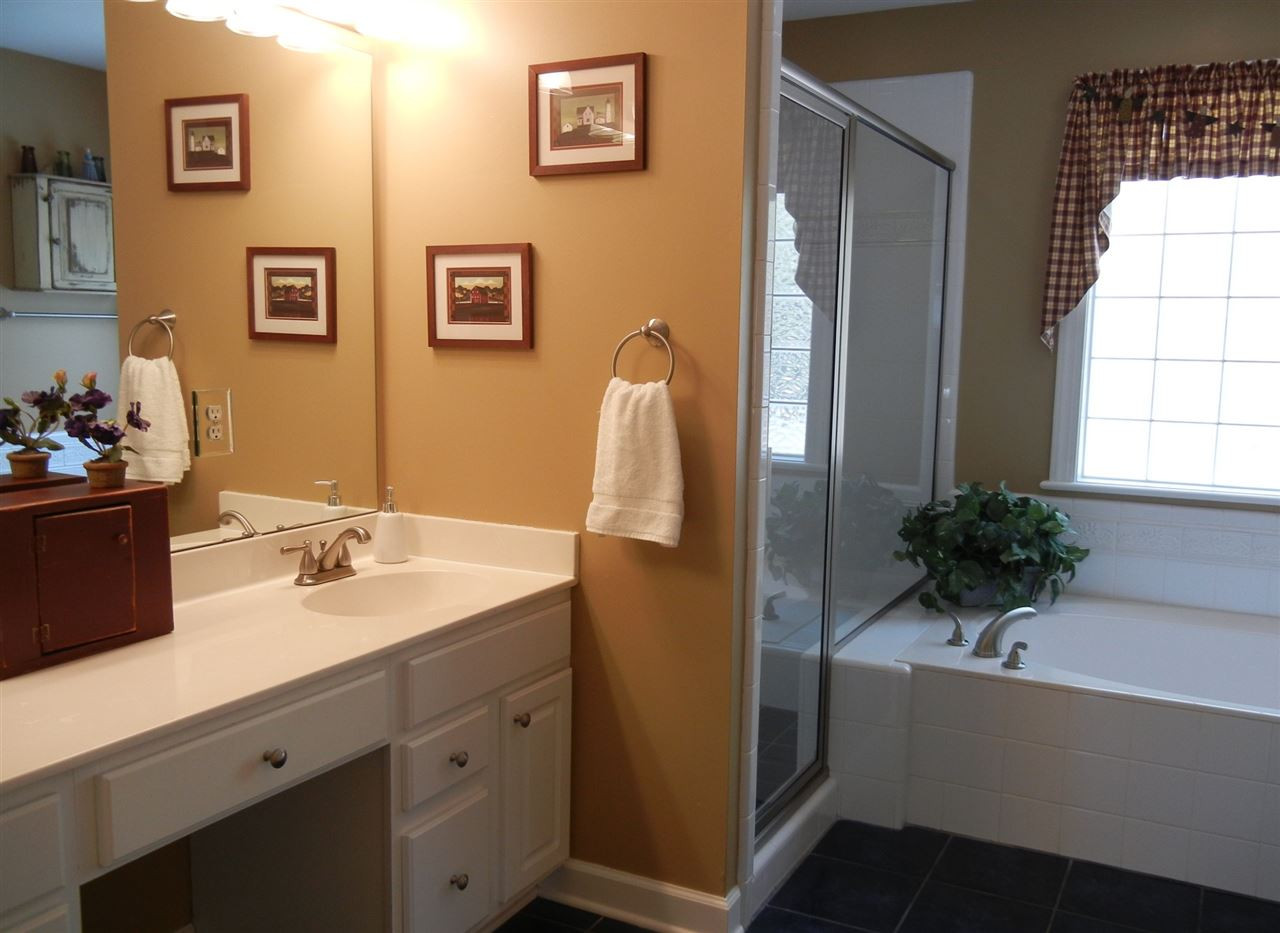 7701 Wilderness Road Raleigh, NC 27613 - Photo 12 of 25 Dual vanities, separate shower, soaking tub, water closet Owners Bath