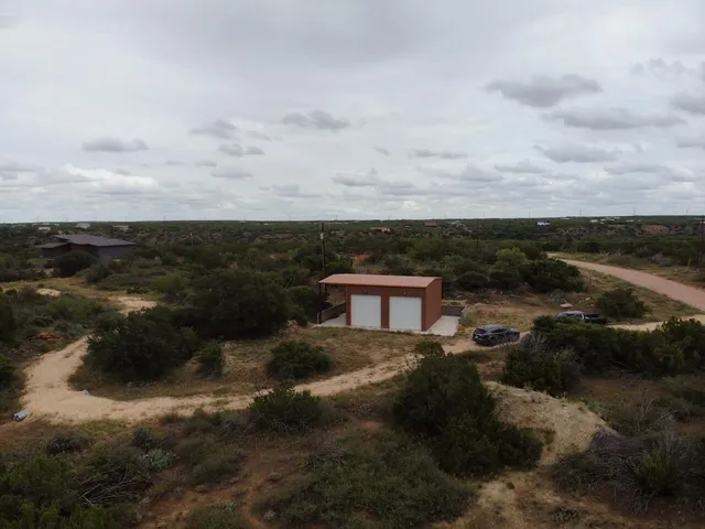 a view of a lake with lots of trees