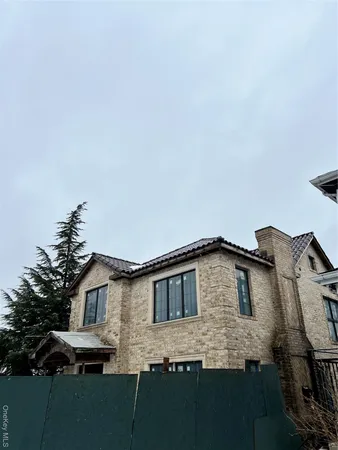 a front view of a house with yard