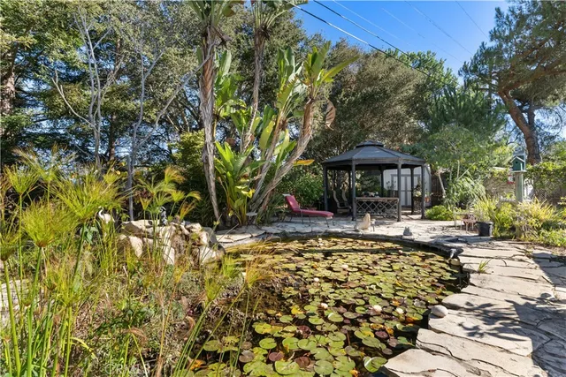 a view of a table and chairs under an umbrella
