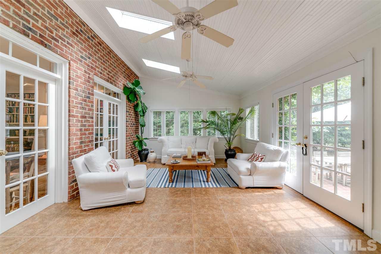 5233 Wildmarsh Drive Raleigh, NC 27613 - Photo 12 of 25 a living room with furniture and a large window