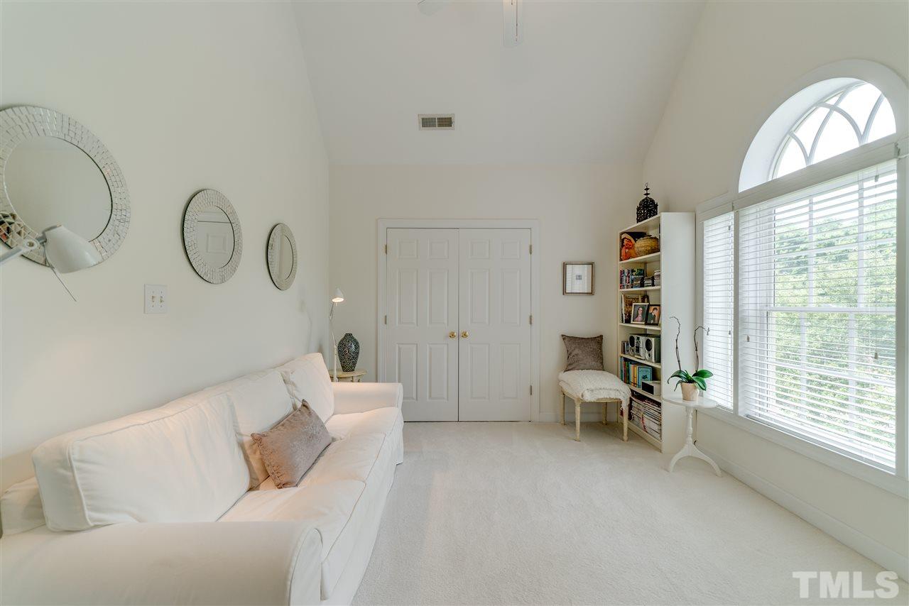 5233 Wildmarsh Drive Raleigh, NC 27613 - Photo 16 of 25 a living room with furniture and a large window