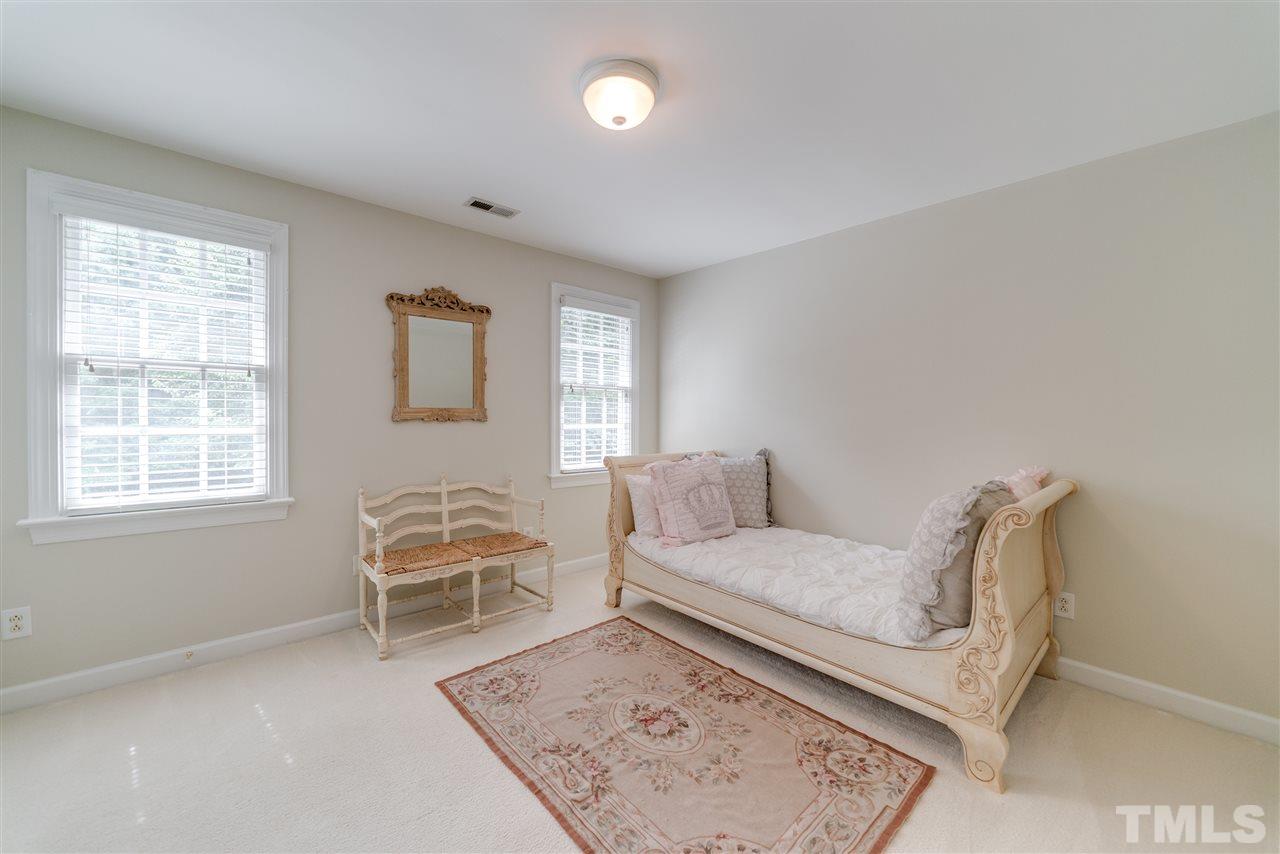 5233 Wildmarsh Drive Raleigh, NC 27613 - Photo 18 of 25 a living room with furniture and a window