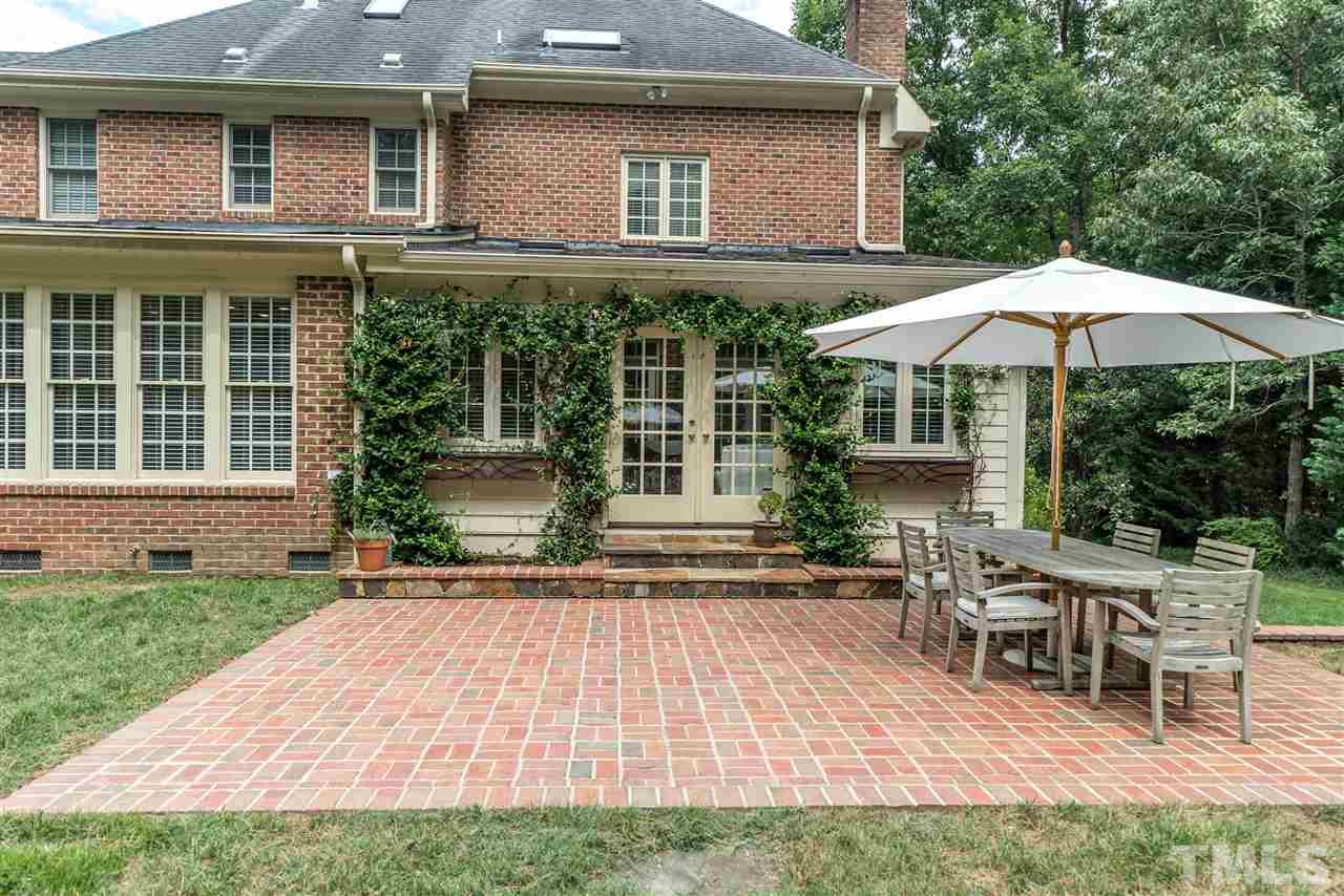 5233 Wildmarsh Drive Raleigh, NC 27613 - Photo 21 of 25 a house view with a sitting space and garden