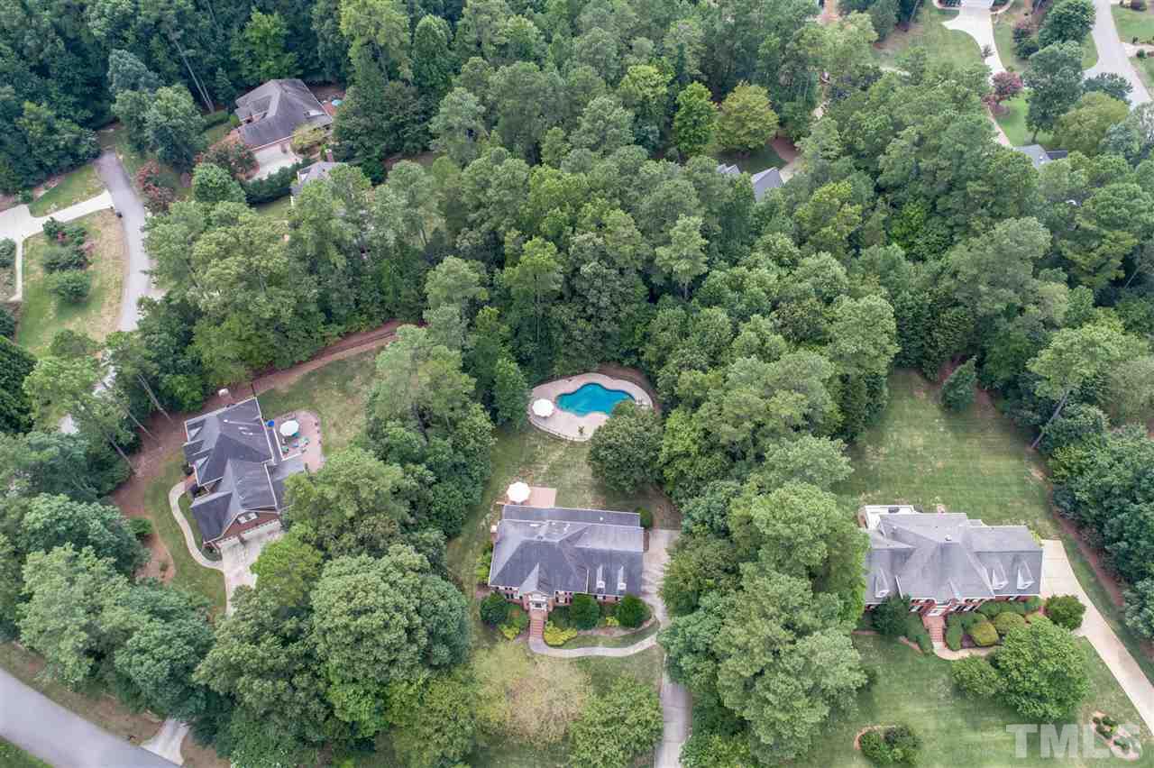 5233 Wildmarsh Drive Raleigh, NC 27613 - Photo 25 of 25 an aerial view of residential house with outdoor space and swimming pool