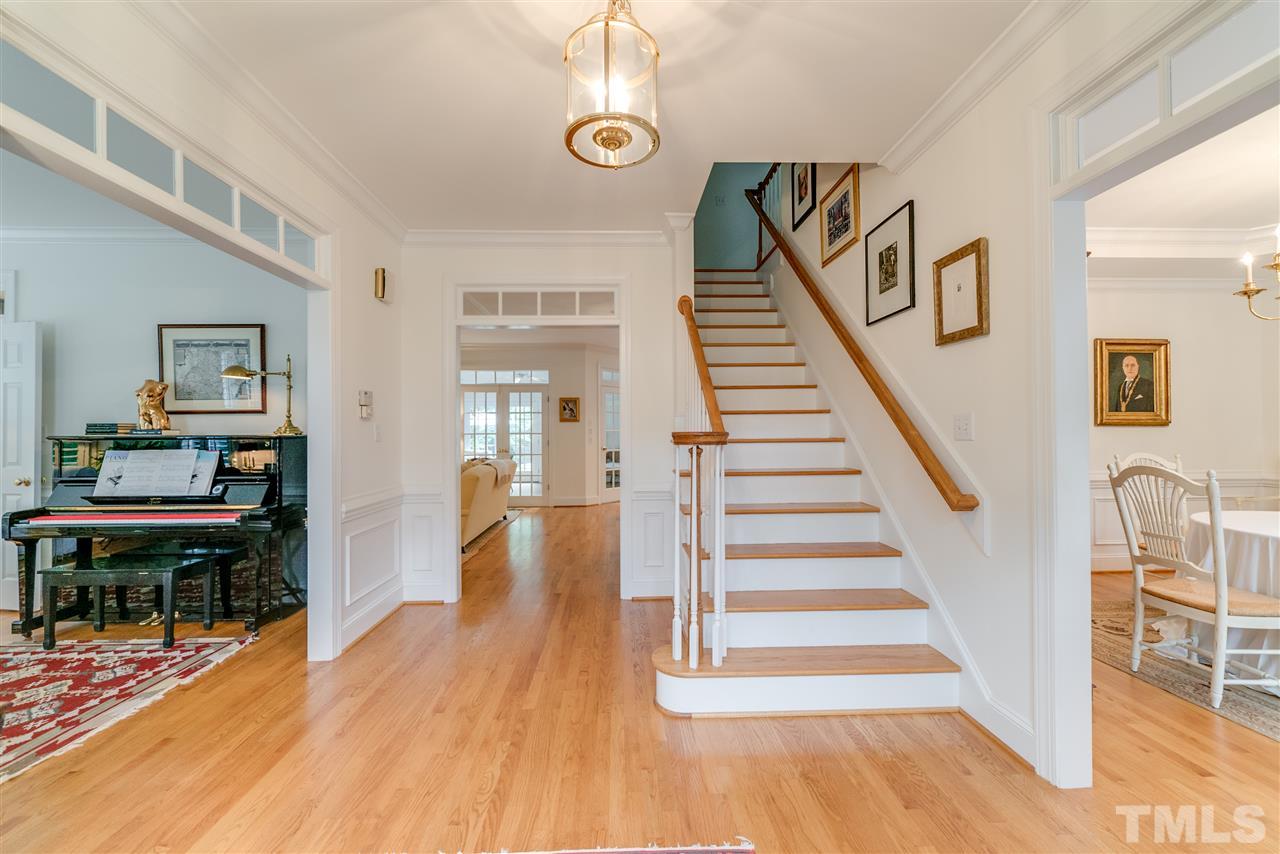5233 Wildmarsh Drive Raleigh, NC 27613 - Photo 3 of 25 a view of entryway and hall with wooden floor