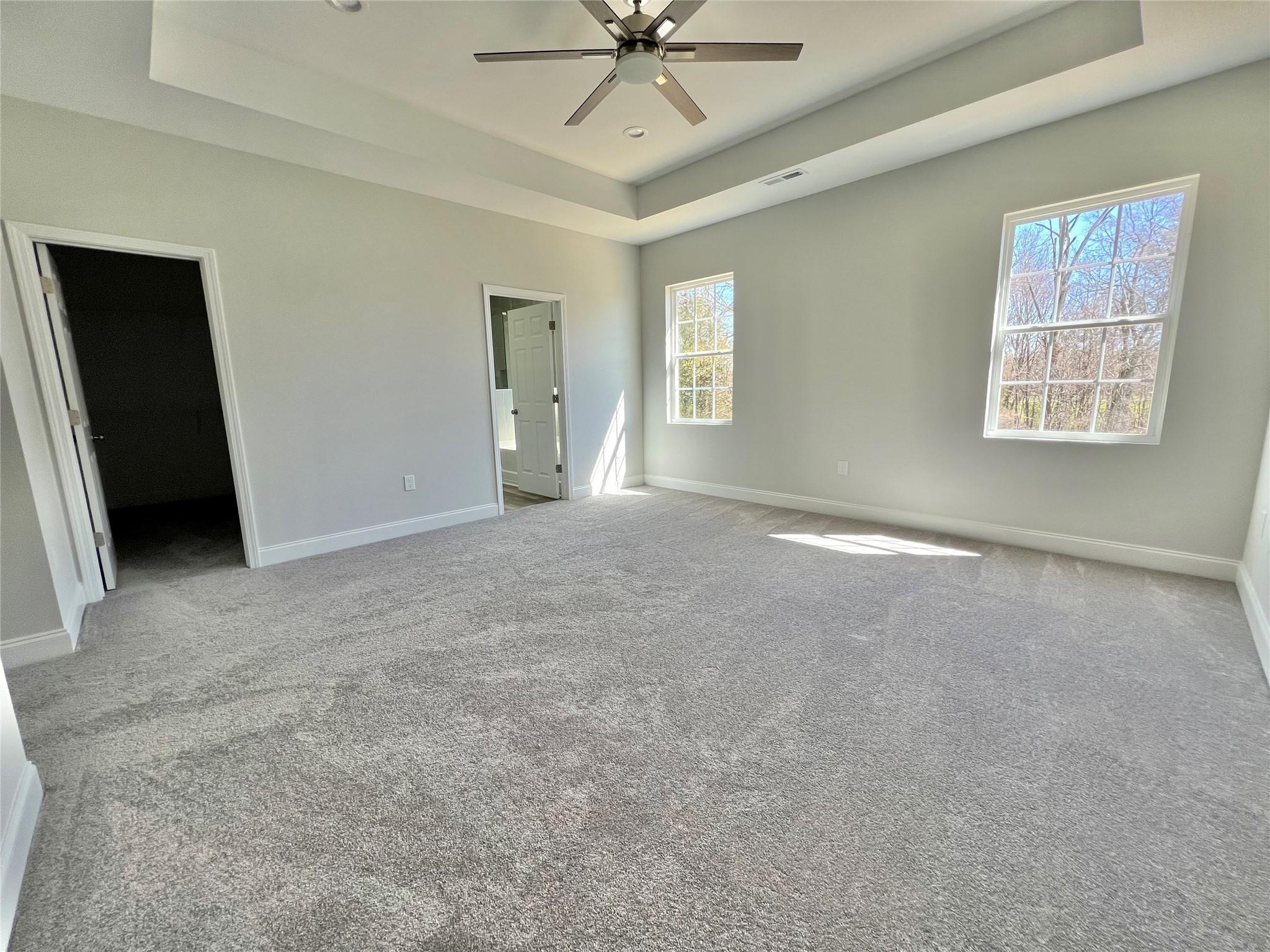 5322 Pond Bluff Drive Monroe, NC 28112 - Photo 13 of 21 an empty room with windows and fan