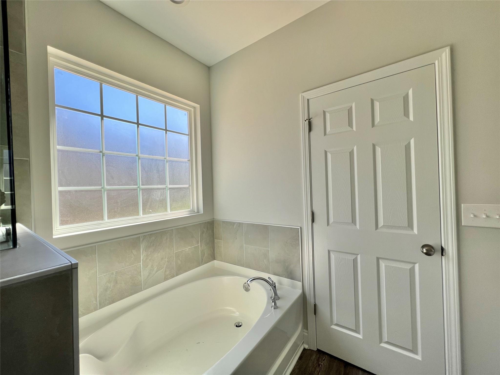 5322 Pond Bluff Drive Monroe, NC 28112 - Photo 15 of 21 a bathroom with a bathtub and shower