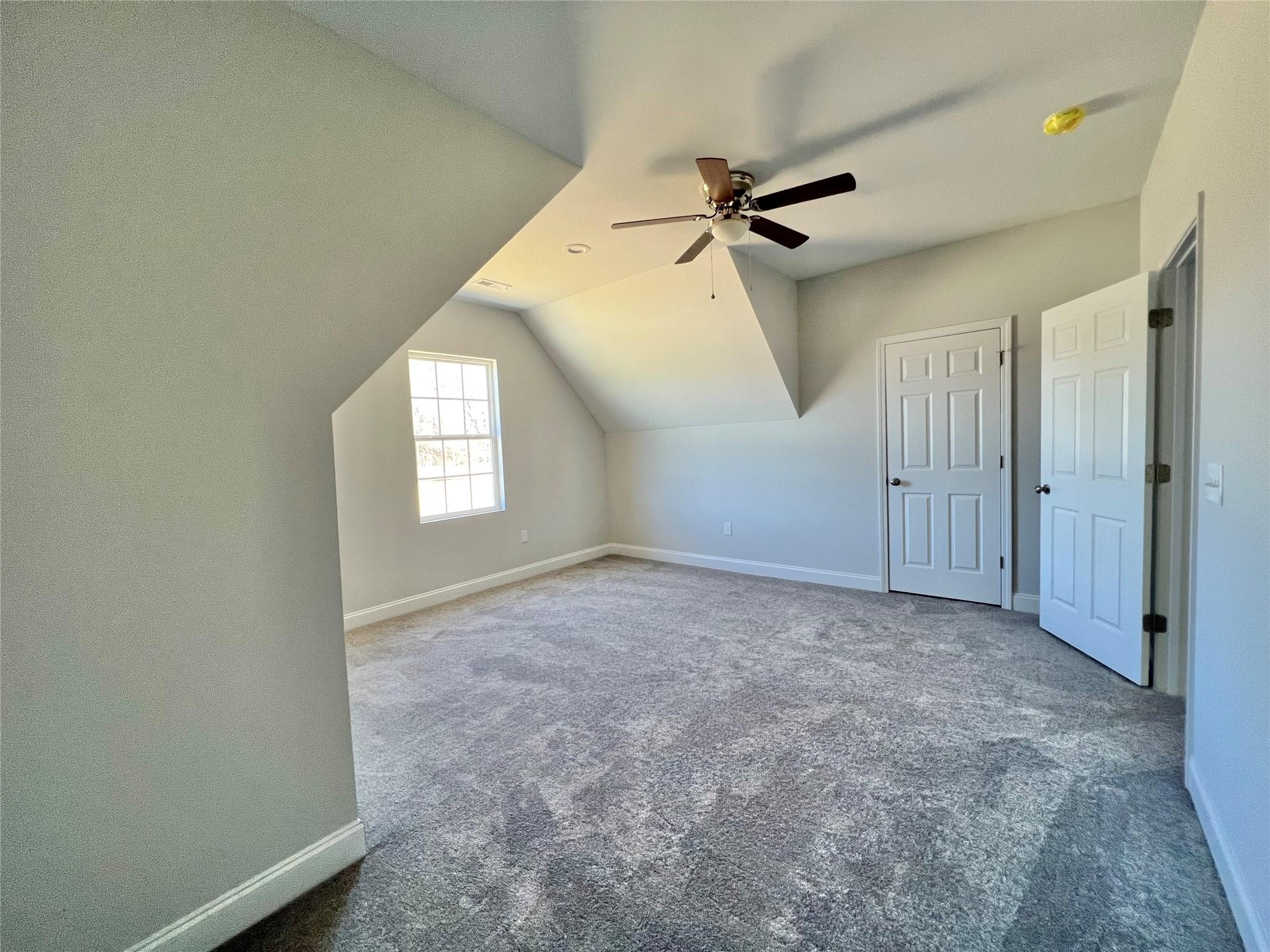 5322 Pond Bluff Drive Monroe, NC 28112 - Photo 16 of 21 an empty room with windows and fan