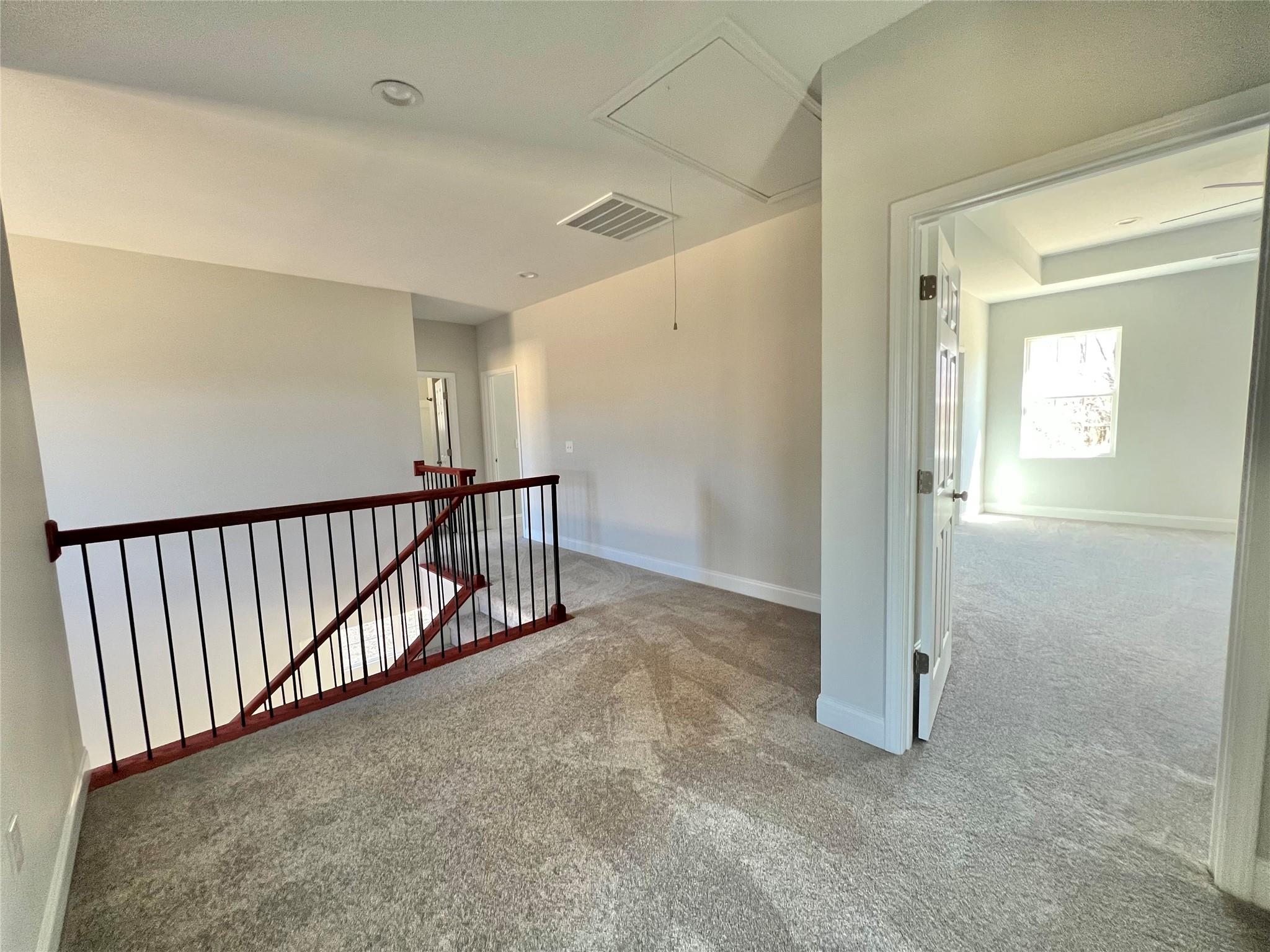 5322 Pond Bluff Drive Monroe, NC 28112 - Photo 17 of 21 en view interior of a house with wooden floor and windows