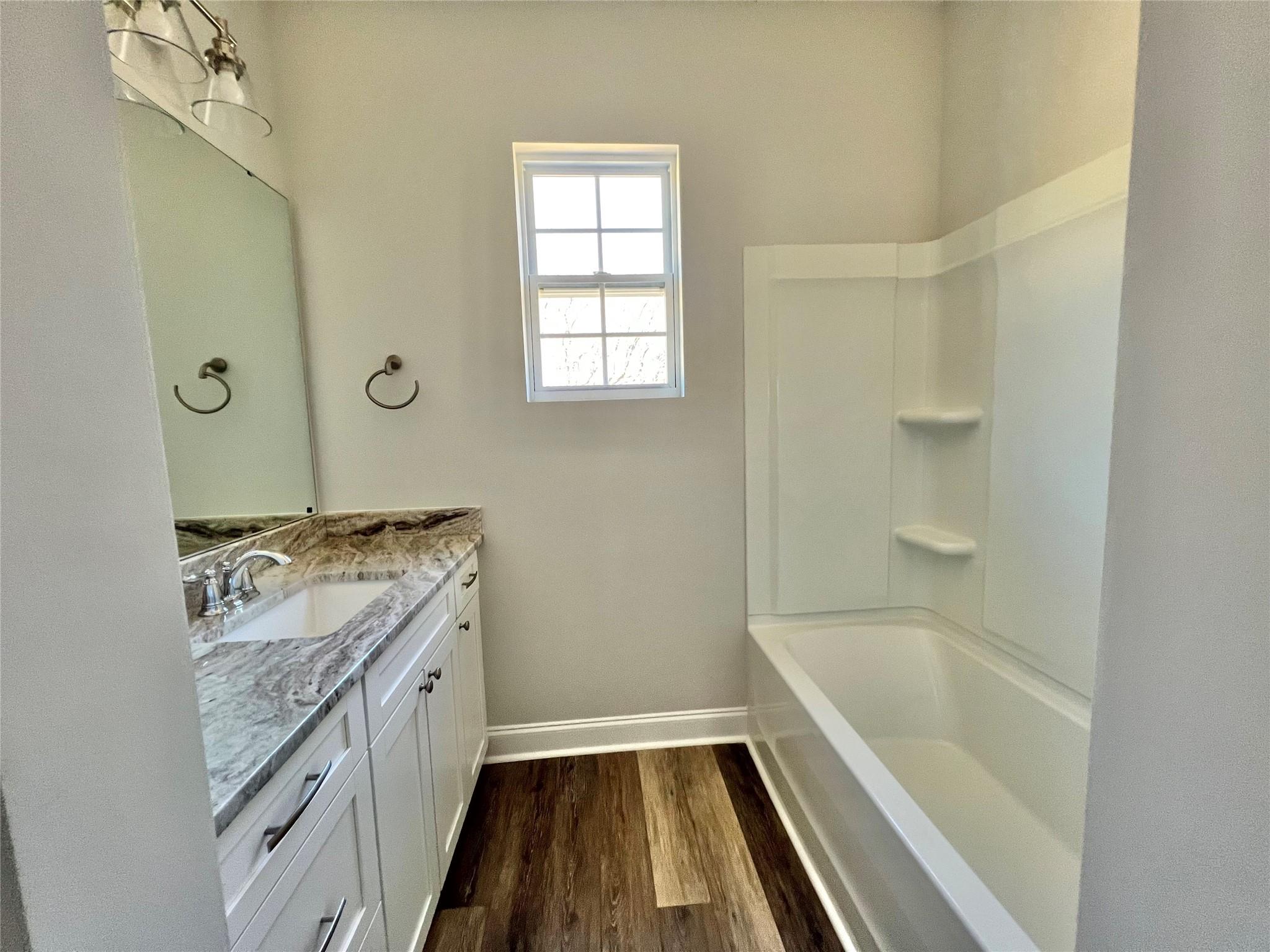 5322 Pond Bluff Drive Monroe, NC 28112 - Photo 21 of 21 a bathroom with a tub sink and mirror