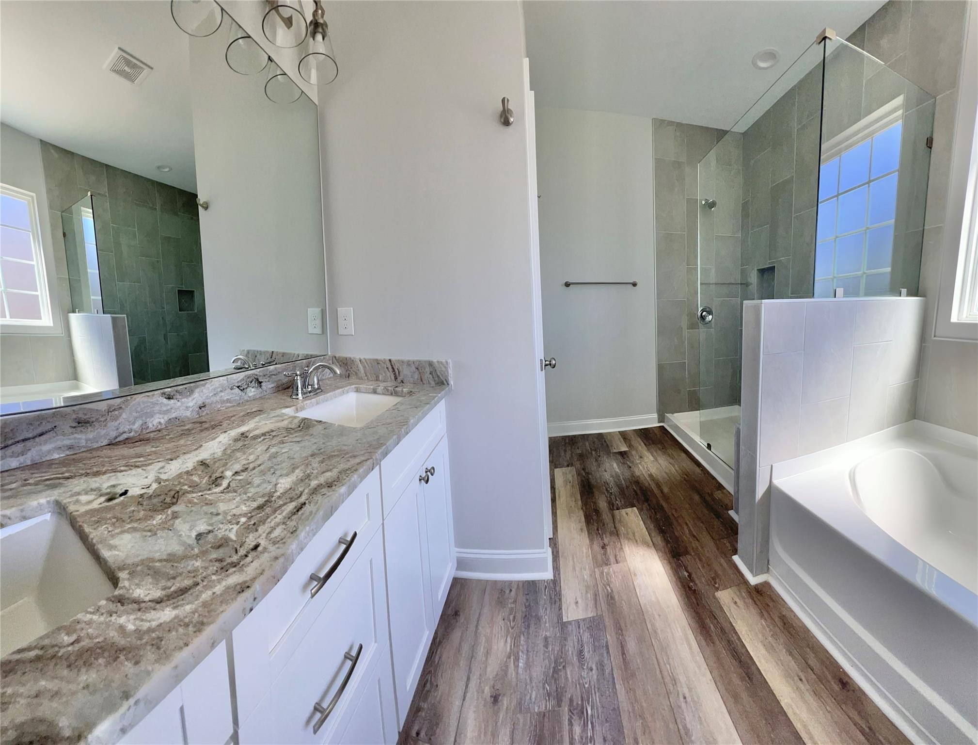 5322 Pond Bluff Drive Monroe, NC 28112 - Photo 9 of 21 a bathroom with a granite countertop sink a toilet and a vanity