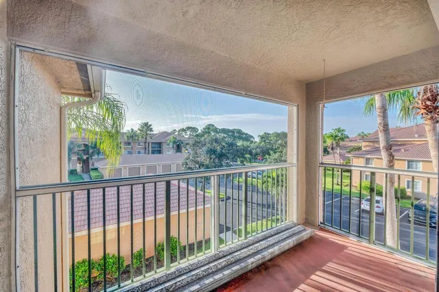 a view of a balcony with glass door