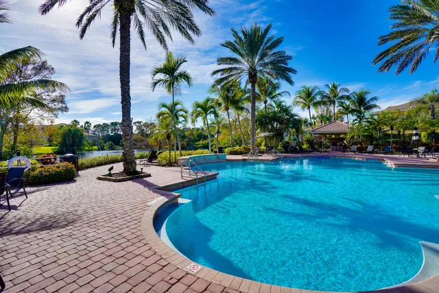 a view of a backyard with swimming pool