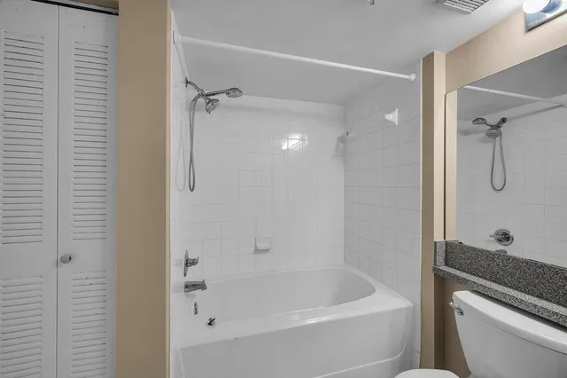 a bathroom with a tub and a shower