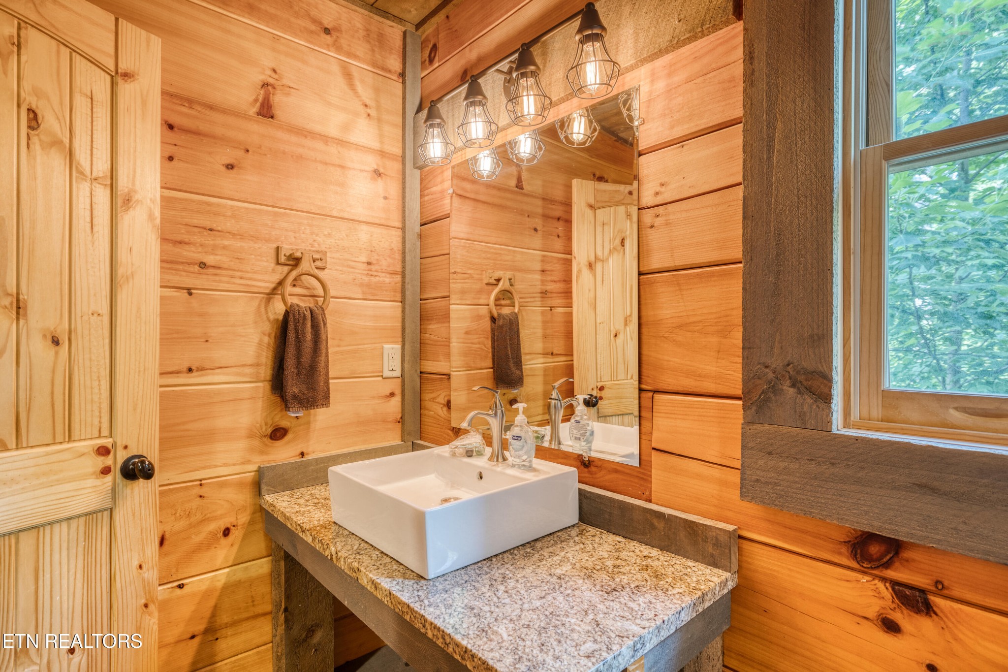 809 Pinecrest Way Sevierville, TN 37862 - Photo 12 of 60 a bathroom with a sink mirror and a shower
