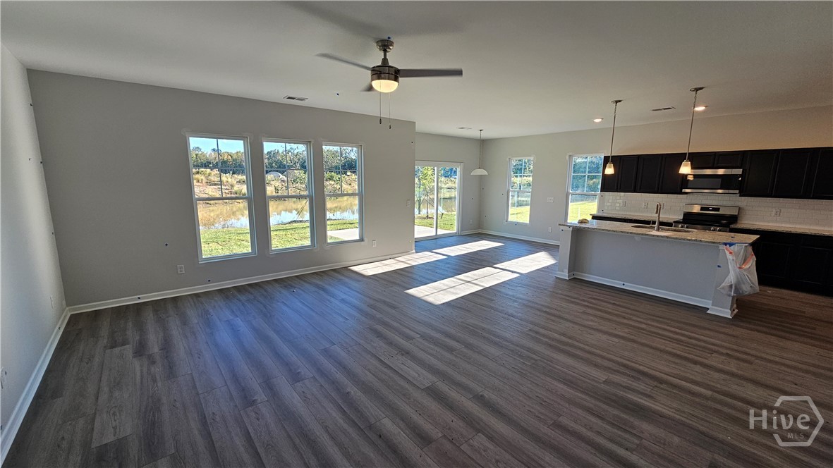 201 Chime Creek Drive Pooler, GA 31322 - Photo 2 of 9 Great Room and Kitchen