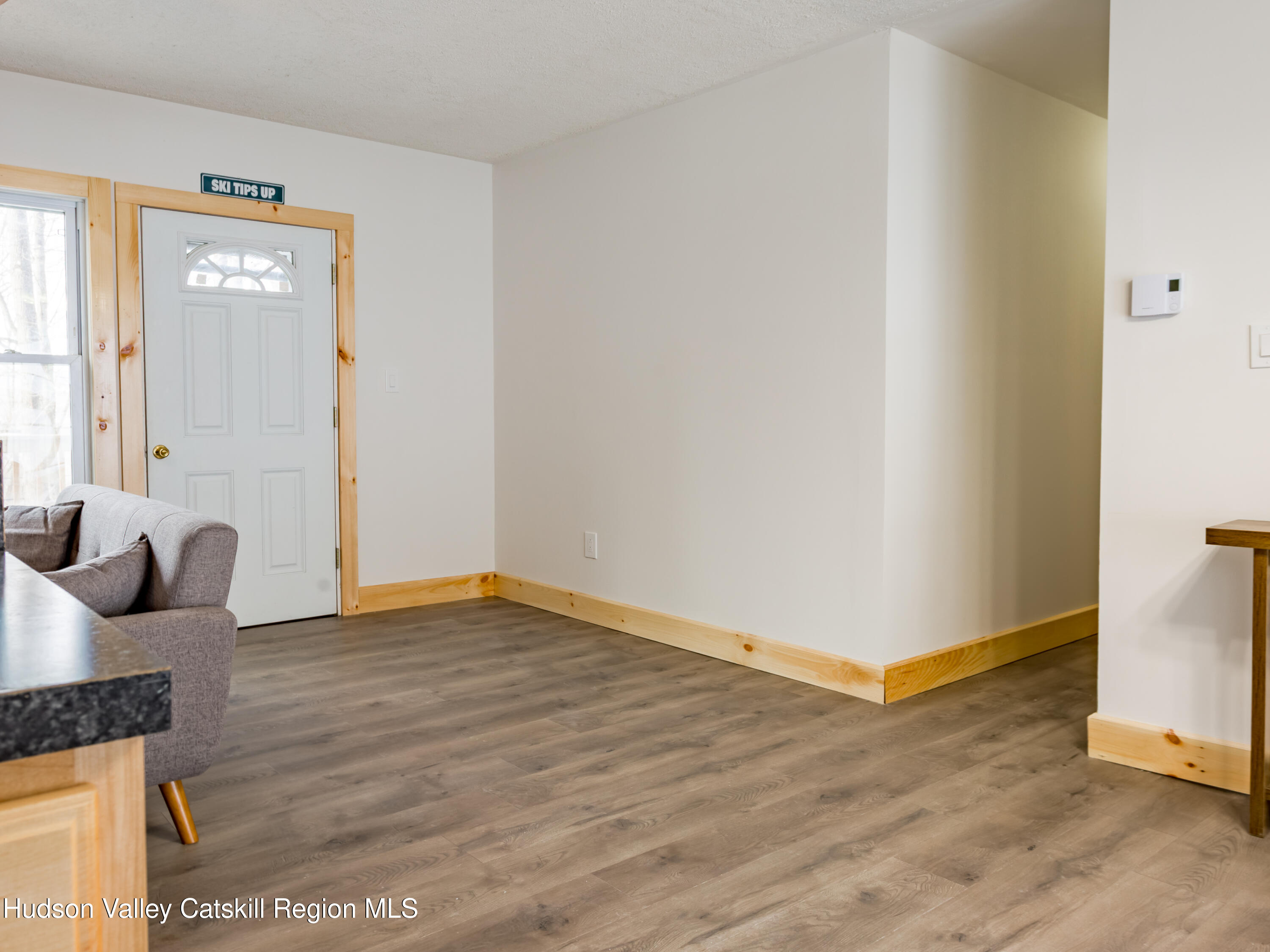 4030 Vega Mountain Road Roxbury, NY 12474 - Photo 16 of 29 an empty room with wooden floor and windows