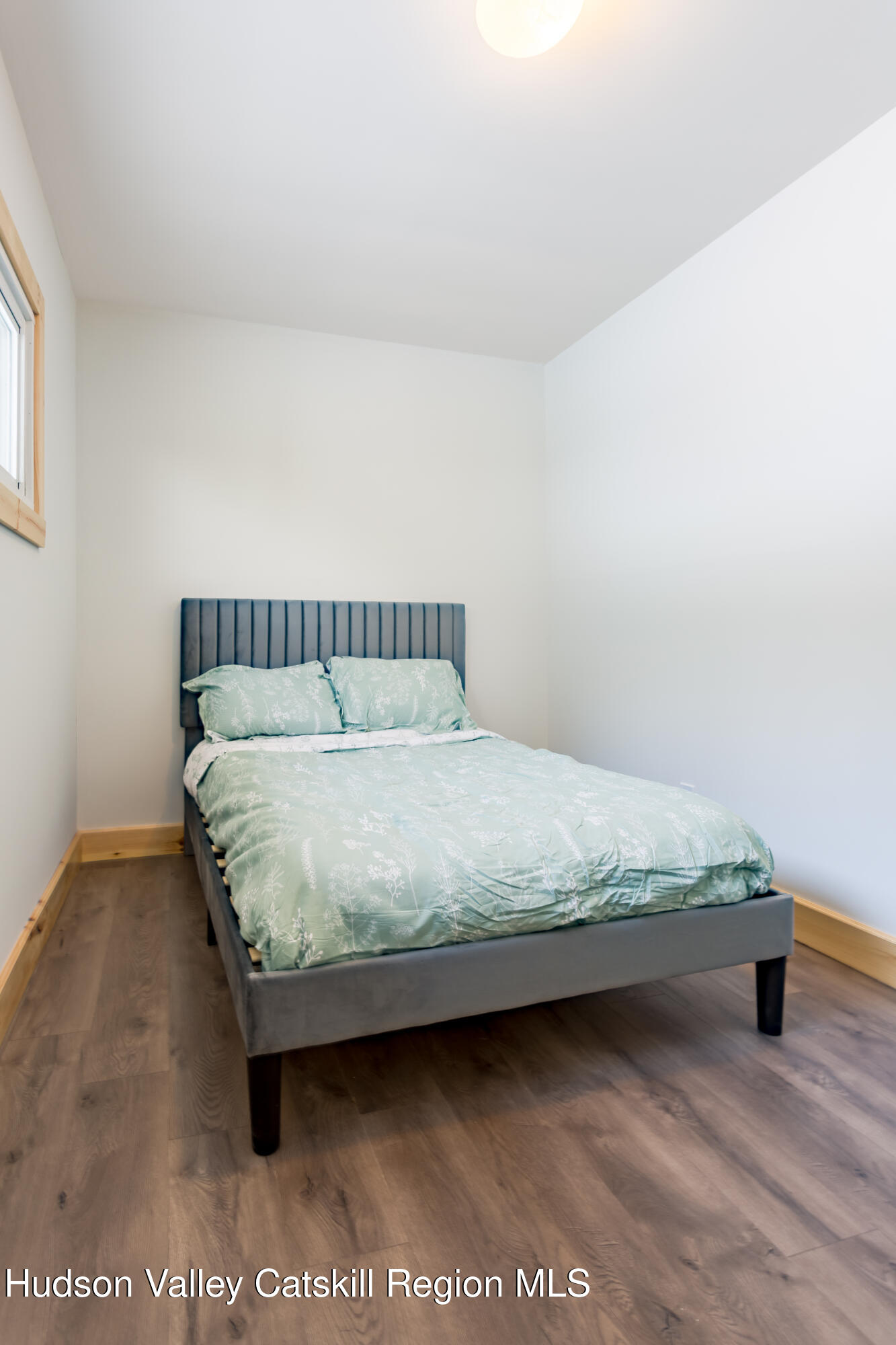 4030 Vega Mountain Road Roxbury, NY 12474 - Photo 22 of 29 a bedroom with a bed and window
