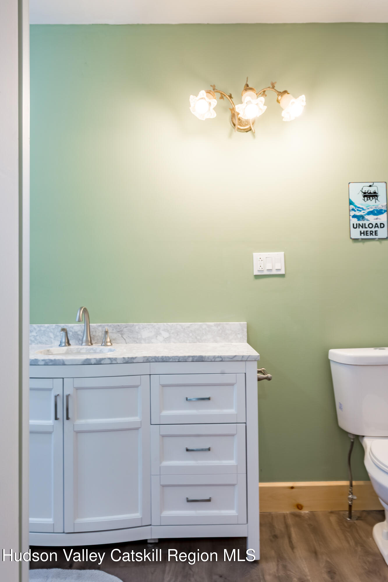 4030 Vega Mountain Road Roxbury, NY 12474 - Photo 23 of 29 a bathroom with a sink a mirror and a toilet