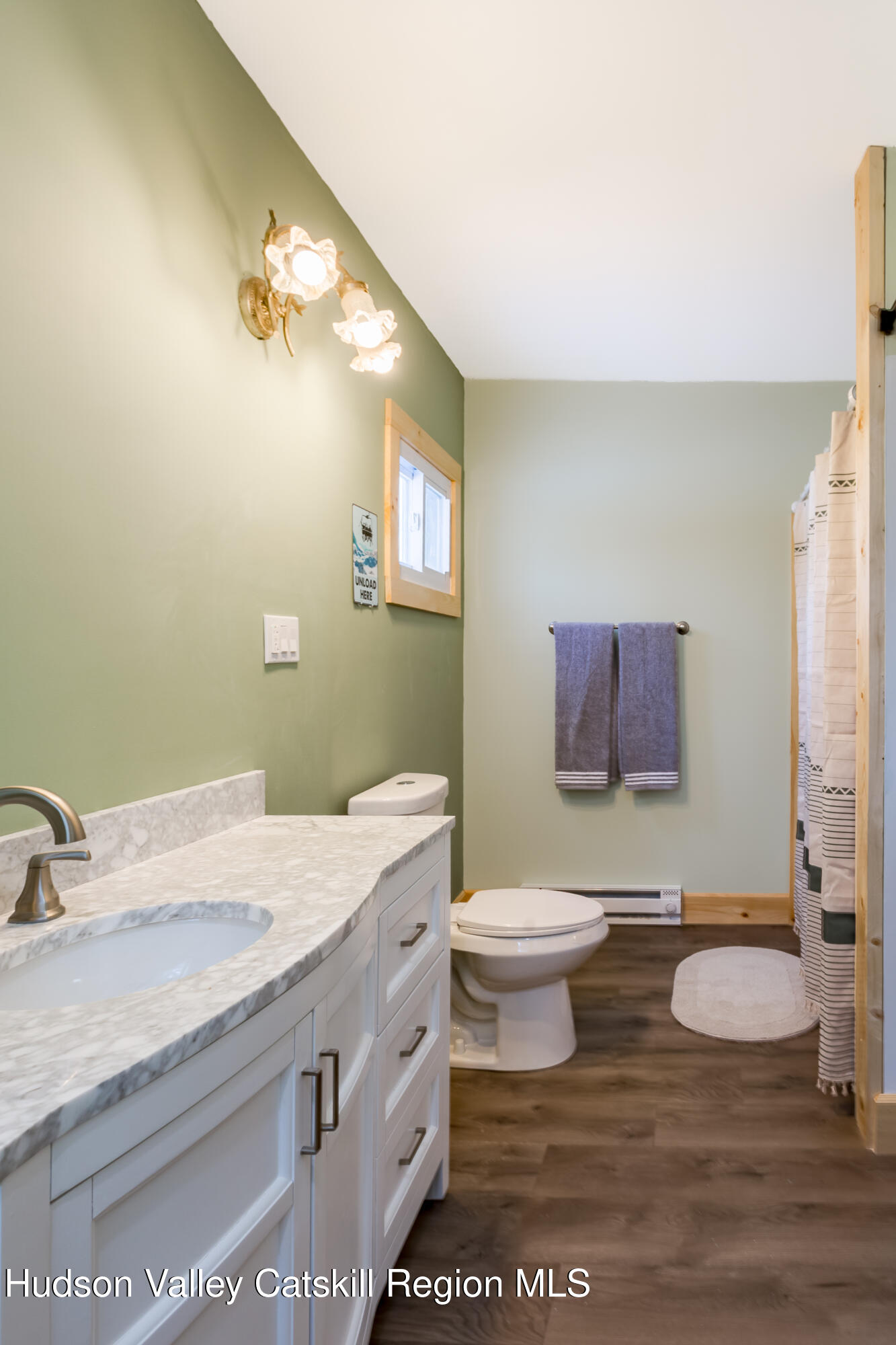 4030 Vega Mountain Road Roxbury, NY 12474 - Photo 24 of 29 a bathroom with a granite countertop toilet sink and mirror