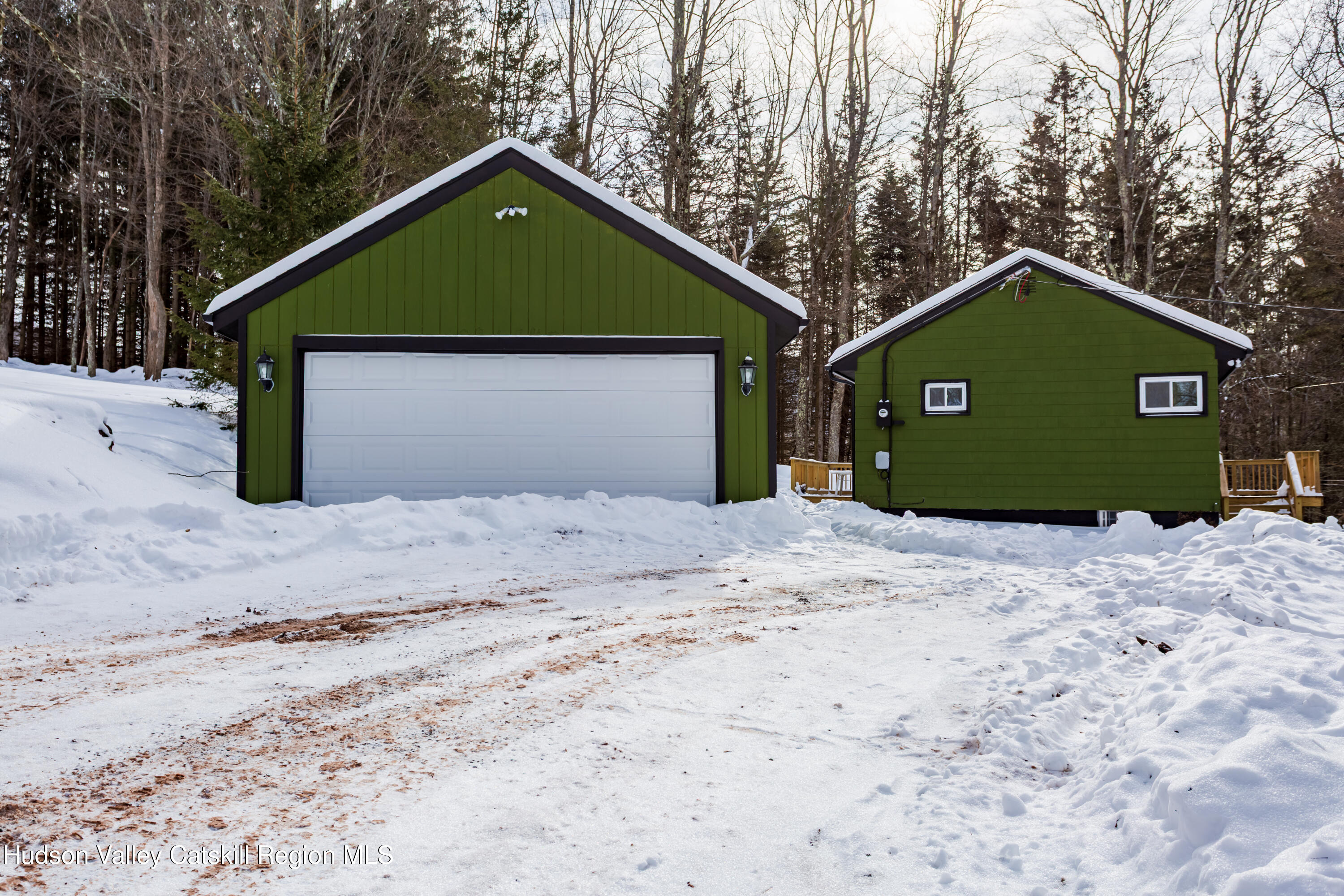 4030 Vega Mountain Road Roxbury, NY 12474 - Photo 3 of 29 a front view of a house with a yard and garage