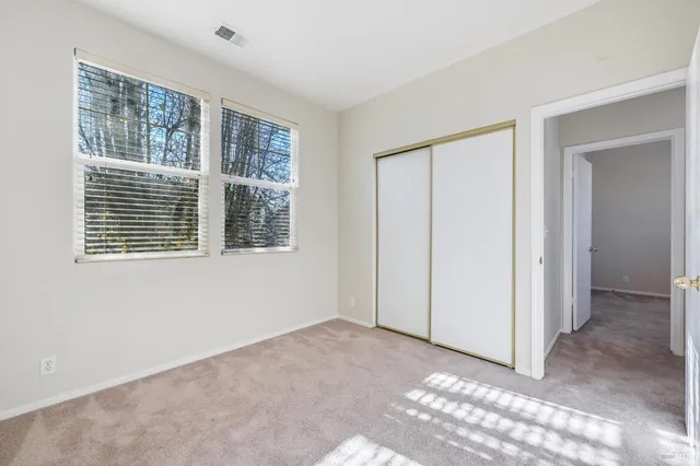 a view of an empty room with windows