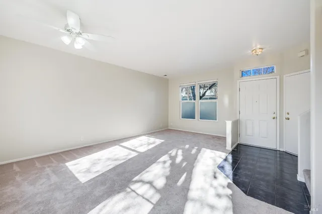 a view of a big room with windows and cabinet