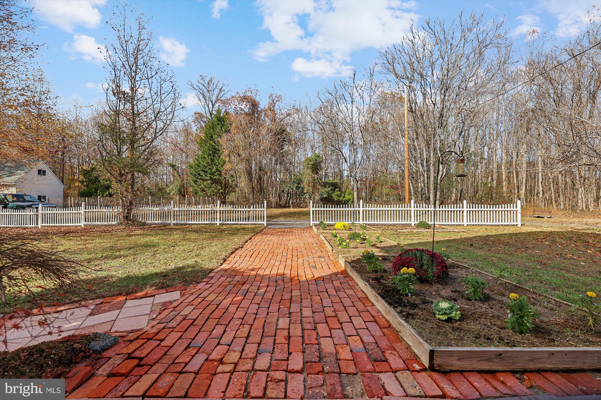 19 Walnut Hill Road La Plata, MD 20646 - Photo 2 of 70 a view of a swimming pool with a bench and trees around
