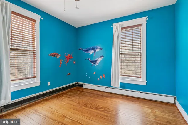 a view of swimming pool with outdoor seating and a garden