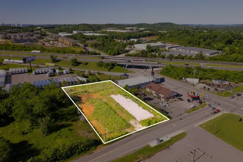 an aerial view of a residential houses with outdoor space