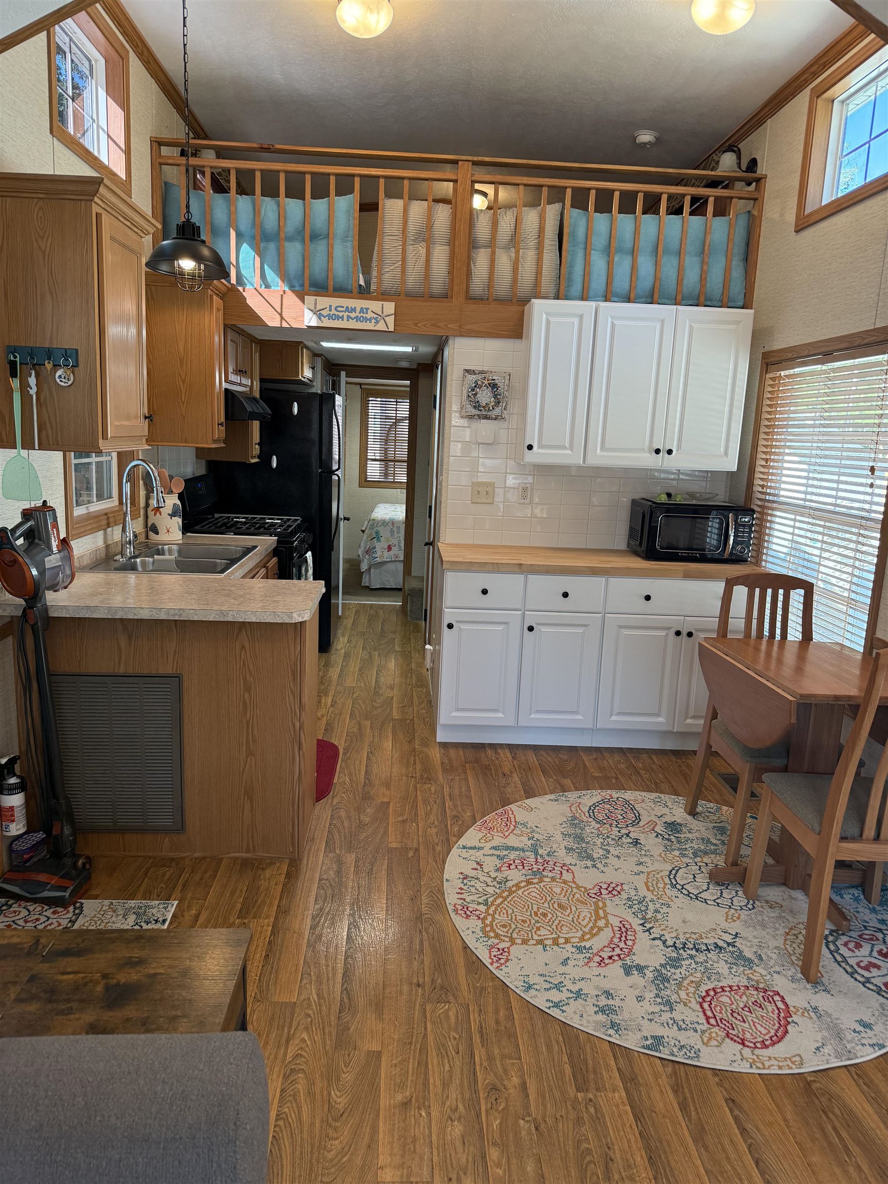 515 Corsons Tavern Road Ocean View, NJ 08230 - Photo 5 of 18 a kitchen with granite countertop a sink stove and cabinets