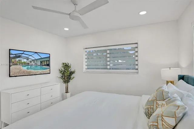 a bedroom with a bed and a cabinet