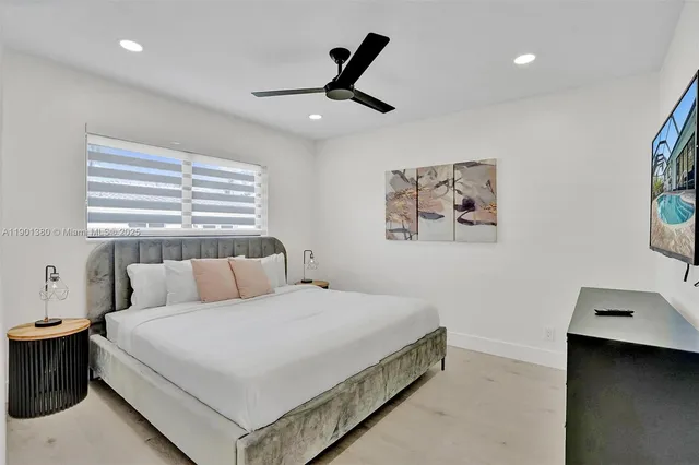 a bedroom with a bed and chair