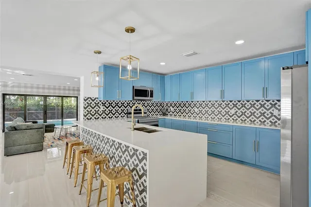 a living room with furniture a rug and a window