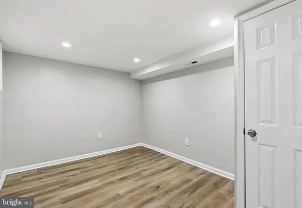 a view of room with wooden floor